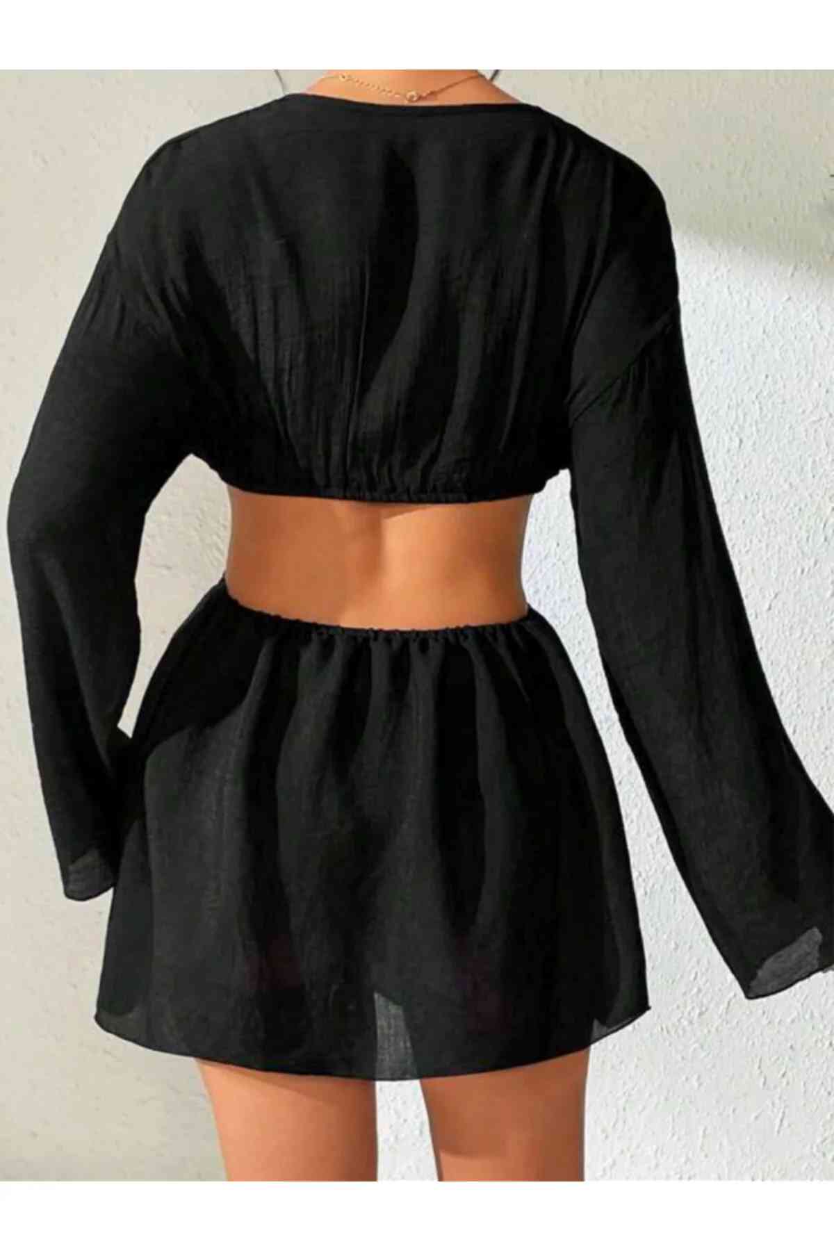 kissbump siyah uzun kollu mini plaj elbisesi – halka detaylı cut out modelkissbump siyah uzun kollu mini elbise, halka detaylı cut out tasarımıyla dikkat çekici bir stil sunar. vücudu saran kesimi silueti ön plana çıkarırken, akışkan ve hafif kumaşı yaz aylarında konfor sağlar. plaj üstü kombinlerde, beach club ortamlarında veya yaz akşamlarında rahatlıkla tercih edilebilir. modern ve feminen bir görünüm arayanlar için tasarlanmıştır. ✨ Ürün Özellikleri renk: siyah model: mini elbise detay: halka detaylı cut out tasarım kol: uzun kollu kullanım: plaj, yazlık kombin, günlük stil 📦 kargo bilgisi siparişleriniz 1–3 iş günü içerisinde kargoya verilir.