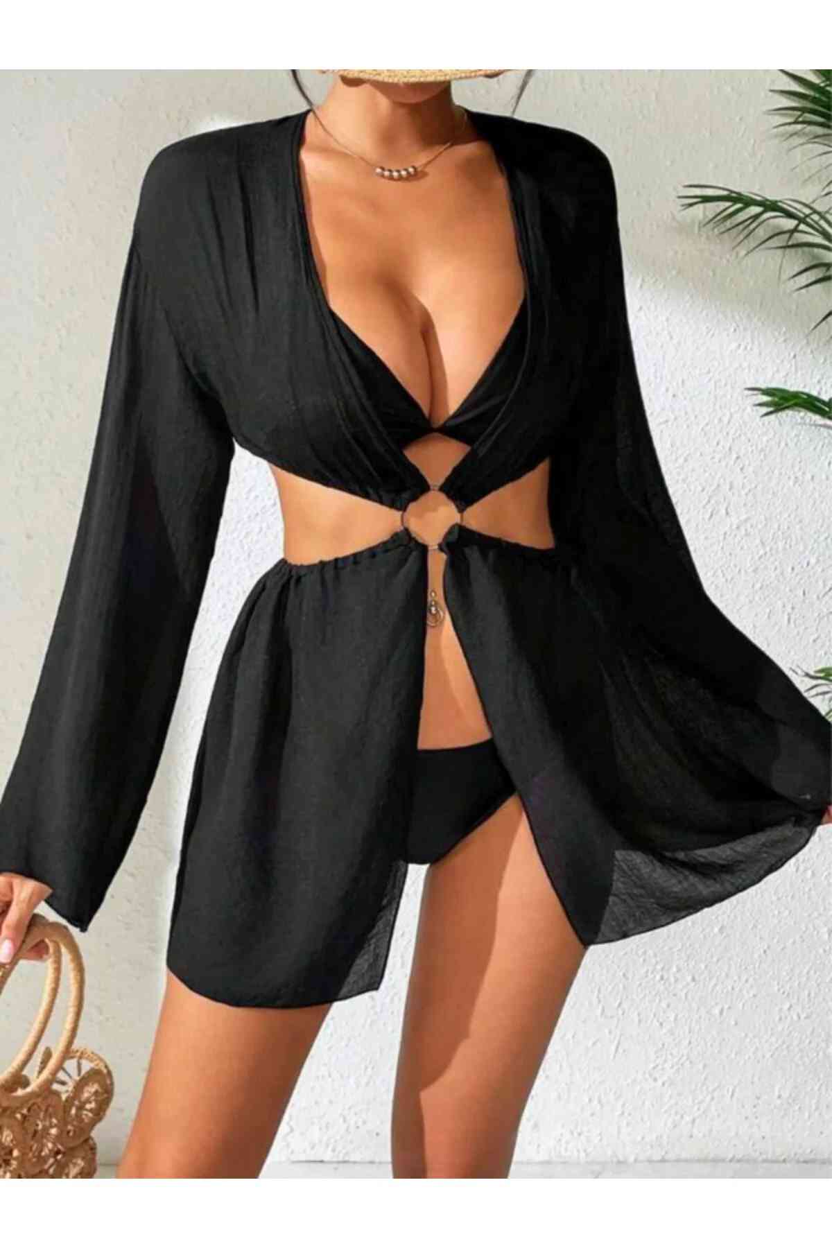 kissbump siyah uzun kollu mini plaj elbisesi – halka detaylı cut out modelkissbump siyah uzun kollu mini elbise, halka detaylı cut out tasarımıyla dikkat çekici bir stil sunar. vücudu saran kesimi silueti ön plana çıkarırken, akışkan ve hafif kumaşı yaz aylarında konfor sağlar. plaj üstü kombinlerde, beach club ortamlarında veya yaz akşamlarında rahatlıkla tercih edilebilir. modern ve feminen bir görünüm arayanlar için tasarlanmıştır. ✨ Ürün Özellikleri renk: siyah model: mini elbise detay: halka detaylı cut out tasarım kol: uzun kollu kullanım: plaj, yazlık kombin, günlük stil 📦 kargo bilgisi siparişleriniz 1–3 iş günü içerisinde kargoya verilir.